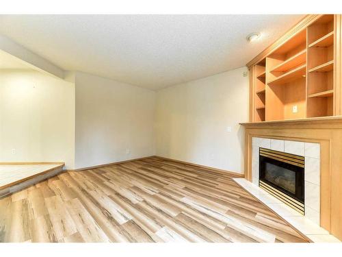 1045 Shawnee Drive Sw, Calgary, AB - Indoor With Fireplace