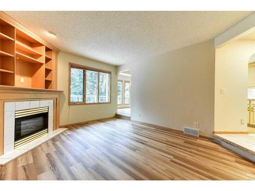 1045 Shawnee Drive Sw, Calgary, AB - Indoor Photo Showing Other Room With Fireplace