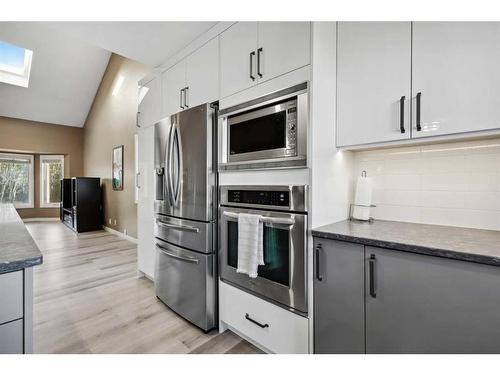 56 Woodfern Way Sw, Calgary, AB - Indoor Photo Showing Kitchen With Stainless Steel Kitchen