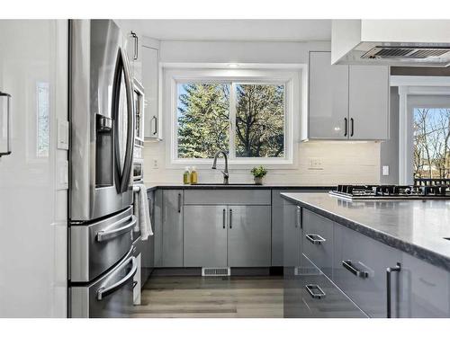 56 Woodfern Way Sw, Calgary, AB - Indoor Photo Showing Kitchen With Upgraded Kitchen