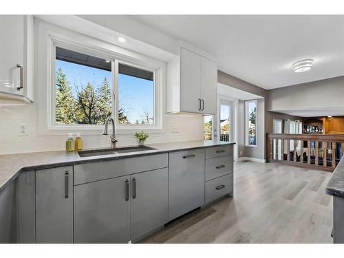 56 Woodfern Way Sw, Calgary, AB - Indoor Photo Showing Kitchen With Double Sink