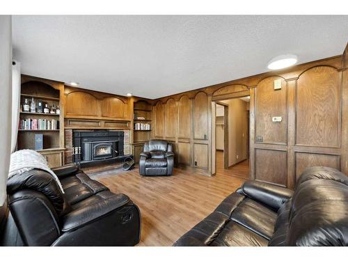 56 Woodfern Way Sw, Calgary, AB - Indoor Photo Showing Living Room With Fireplace