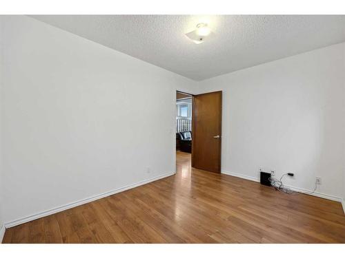 56 Woodfern Way Sw, Calgary, AB - Indoor Photo Showing Other Room