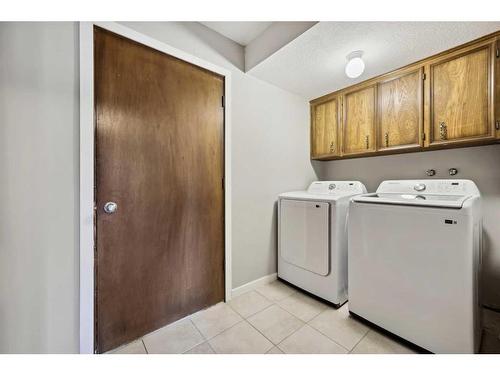 56 Woodfern Way Sw, Calgary, AB - Indoor Photo Showing Laundry Room