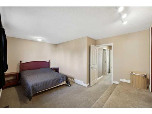 56 Woodfern Way Sw, Calgary, AB - Indoor Photo Showing Bedroom