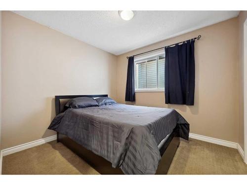 56 Woodfern Way Sw, Calgary, AB - Indoor Photo Showing Bedroom