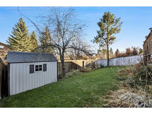 56 Woodfern Way Sw, Calgary, AB - Outdoor With Backyard