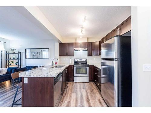 107 Pantego Lane Nw, Calgary, AB - Indoor Photo Showing Kitchen With Stainless Steel Kitchen With Double Sink