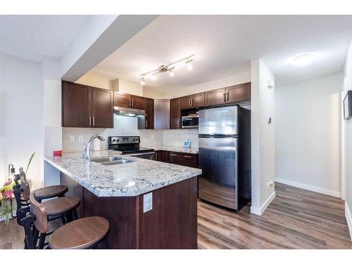 107 Pantego Lane Nw, Calgary, AB - Indoor Photo Showing Kitchen With Double Sink