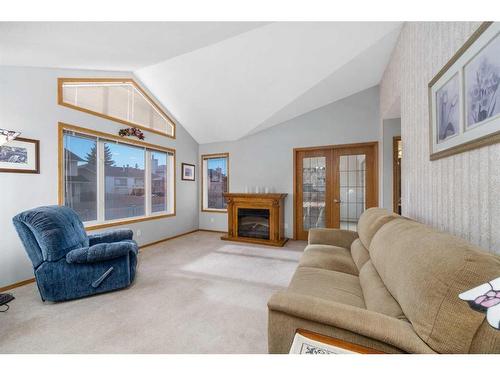 60 Del Monica Villas Ne, Calgary, AB - Indoor Photo Showing Living Room With Fireplace