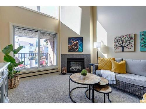 731-6400 Coach Hill Road Sw, Calgary, AB - Indoor Photo Showing Living Room With Fireplace