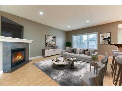 144 Cove Rise, Chestermere, AB - Indoor Photo Showing Living Room With Fireplace