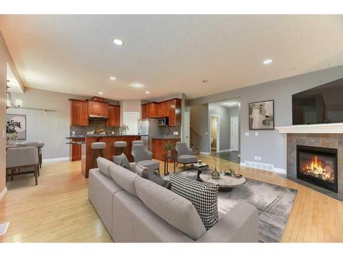 144 Cove Rise, Chestermere, AB - Indoor Photo Showing Living Room With Fireplace