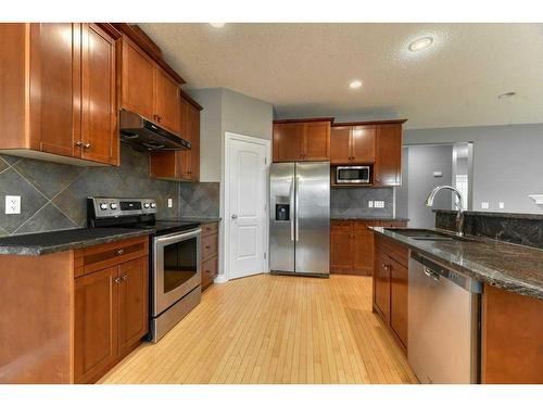 144 Cove Rise, Chestermere, AB - Indoor Photo Showing Kitchen With Double Sink