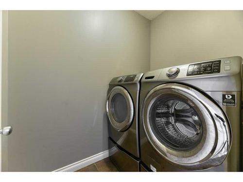 144 Cove Rise, Chestermere, AB - Indoor Photo Showing Laundry Room