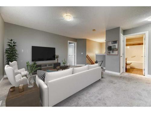 144 Cove Rise, Chestermere, AB - Indoor Photo Showing Living Room