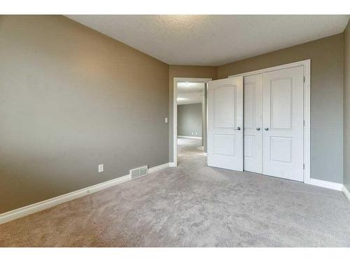 144 Cove Rise, Chestermere, AB - Indoor Photo Showing Other Room