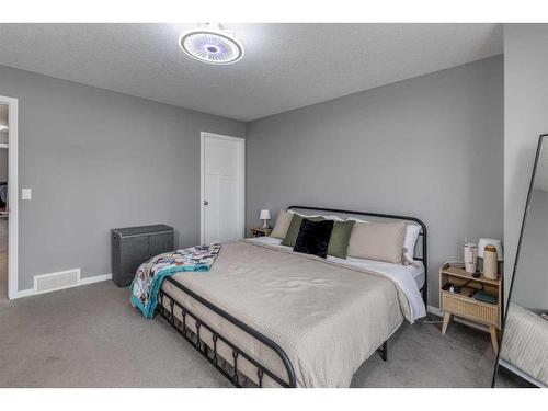 13 Willow Green Way, Cochrane, AB - Indoor Photo Showing Bedroom