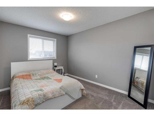 13 Willow Green Way, Cochrane, AB - Indoor Photo Showing Bedroom