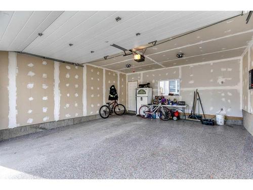 13 Willow Green Way, Cochrane, AB - Indoor Photo Showing Garage