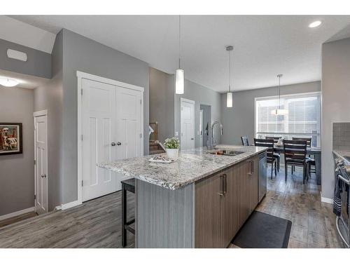 13 Willow Green Way, Cochrane, AB - Indoor Photo Showing Kitchen With Double Sink With Upgraded Kitchen