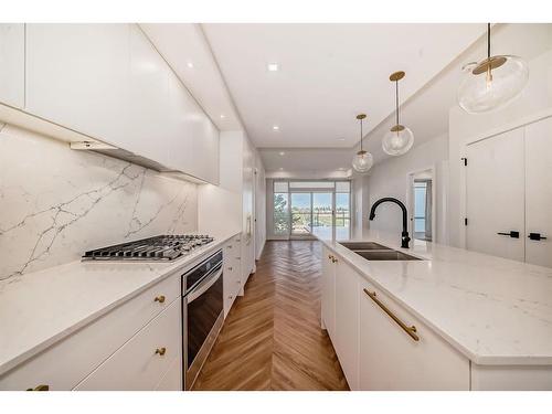 313-8445 Broadcast Avenue Sw, Calgary, AB - Indoor Photo Showing Kitchen With Double Sink With Upgraded Kitchen