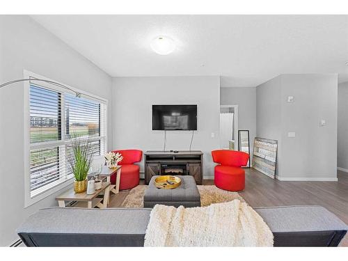 115-4150 Seton Drive, Calgary, AB - Indoor Photo Showing Living Room