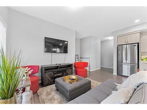 115-4150 Seton Drive, Calgary, AB - Indoor Photo Showing Living Room