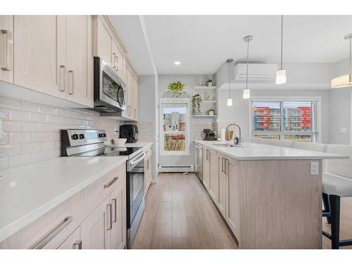 115-4150 Seton Drive, Calgary, AB - Indoor Photo Showing Kitchen With Upgraded Kitchen