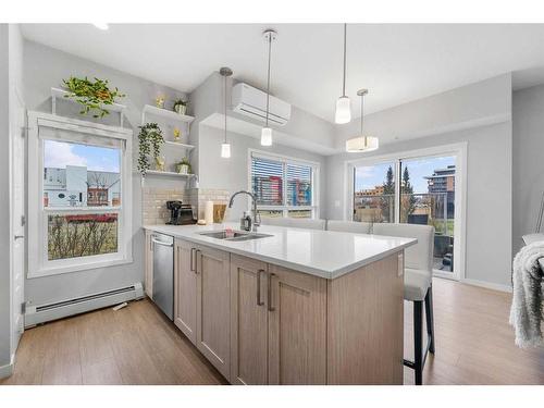 115-4150 Seton Drive, Calgary, AB - Indoor Photo Showing Kitchen With Double Sink With Upgraded Kitchen