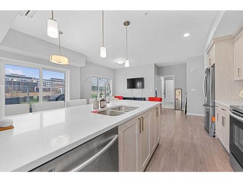 115-4150 Seton Drive, Calgary, AB - Indoor Photo Showing Kitchen With Double Sink With Upgraded Kitchen