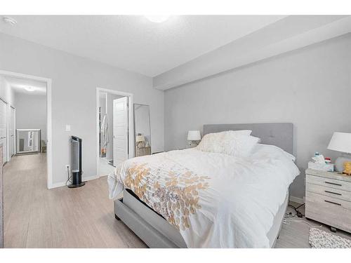 115-4150 Seton Drive, Calgary, AB - Indoor Photo Showing Bedroom