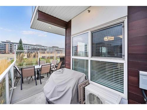 115-4150 Seton Drive, Calgary, AB - Outdoor With Deck Patio Veranda With View With Exterior