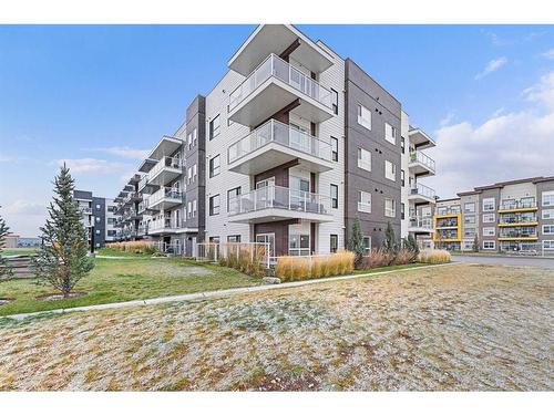 115-4150 Seton Drive, Calgary, AB - Outdoor With Balcony With Facade