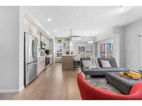 115-4150 Seton Drive, Calgary, AB - Indoor Photo Showing Living Room