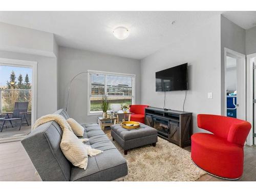 115-4150 Seton Drive, Calgary, AB - Indoor Photo Showing Living Room