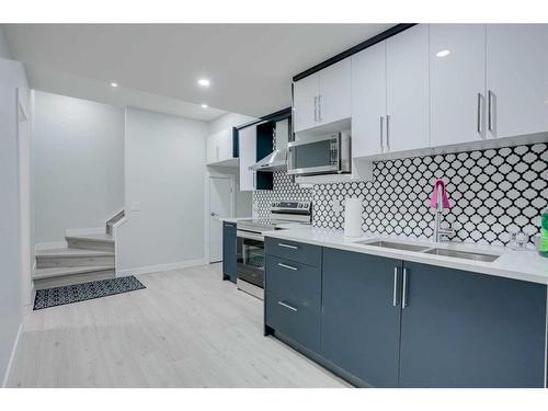 673 Corner Meadows Way Ne, Calgary, AB - Indoor Photo Showing Kitchen With Double Sink