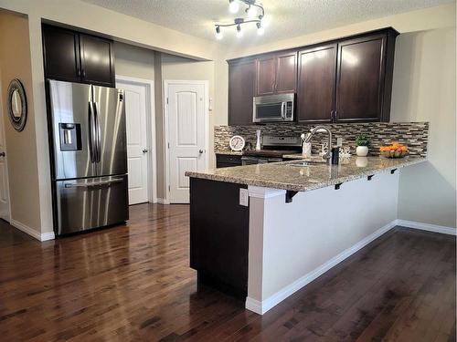 1817 Baywater Gardens Sw, Airdrie, AB - Indoor Photo Showing Kitchen With Stainless Steel Kitchen With Double Sink With Upgraded Kitchen