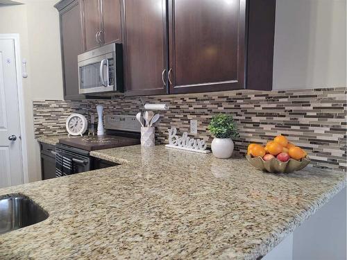 1817 Baywater Gardens Sw, Airdrie, AB - Indoor Photo Showing Kitchen With Upgraded Kitchen