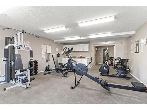 3128-3000 Millrise Point Sw, Calgary, AB - Indoor Photo Showing Gym Room