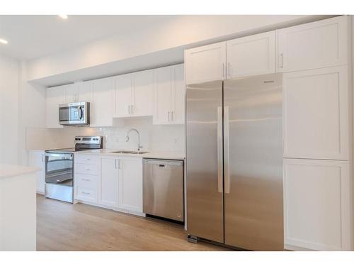 137 19Th Avenue Se, Calgary, AB - Indoor Photo Showing Kitchen With Stainless Steel Kitchen