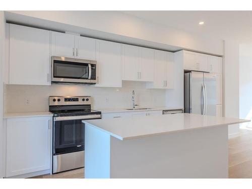 137 19Th Avenue Se, Calgary, AB - Indoor Photo Showing Kitchen With Stainless Steel Kitchen With Upgraded Kitchen