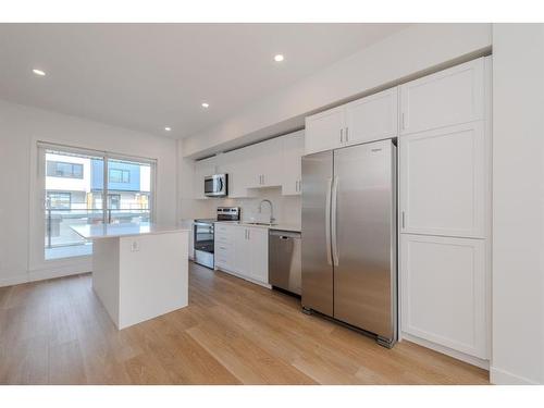 137 19Th Avenue Se, Calgary, AB - Indoor Photo Showing Kitchen With Stainless Steel Kitchen