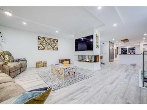 2016 Lake Bonavista Drive Se, Calgary, AB - Indoor Photo Showing Living Room With Fireplace