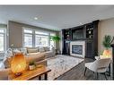 79 West Grove Rise Sw, Calgary, AB  - Indoor Photo Showing Living Room With Fireplace 