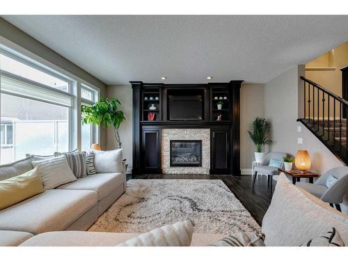 79 West Grove Rise Sw, Calgary, AB - Indoor Photo Showing Living Room With Fireplace