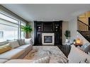 79 West Grove Rise Sw, Calgary, AB  - Indoor Photo Showing Living Room With Fireplace 