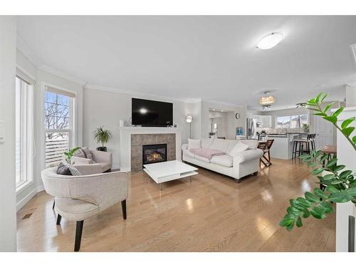 63 Cramond Green Se, Calgary, AB - Indoor Photo Showing Living Room With Fireplace