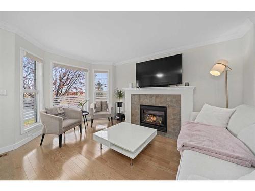 63 Cramond Green Se, Calgary, AB - Indoor Photo Showing Living Room With Fireplace