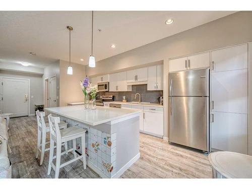 220-7 Westpark Common Sw, Calgary, AB - Indoor Photo Showing Kitchen With Stainless Steel Kitchen With Upgraded Kitchen